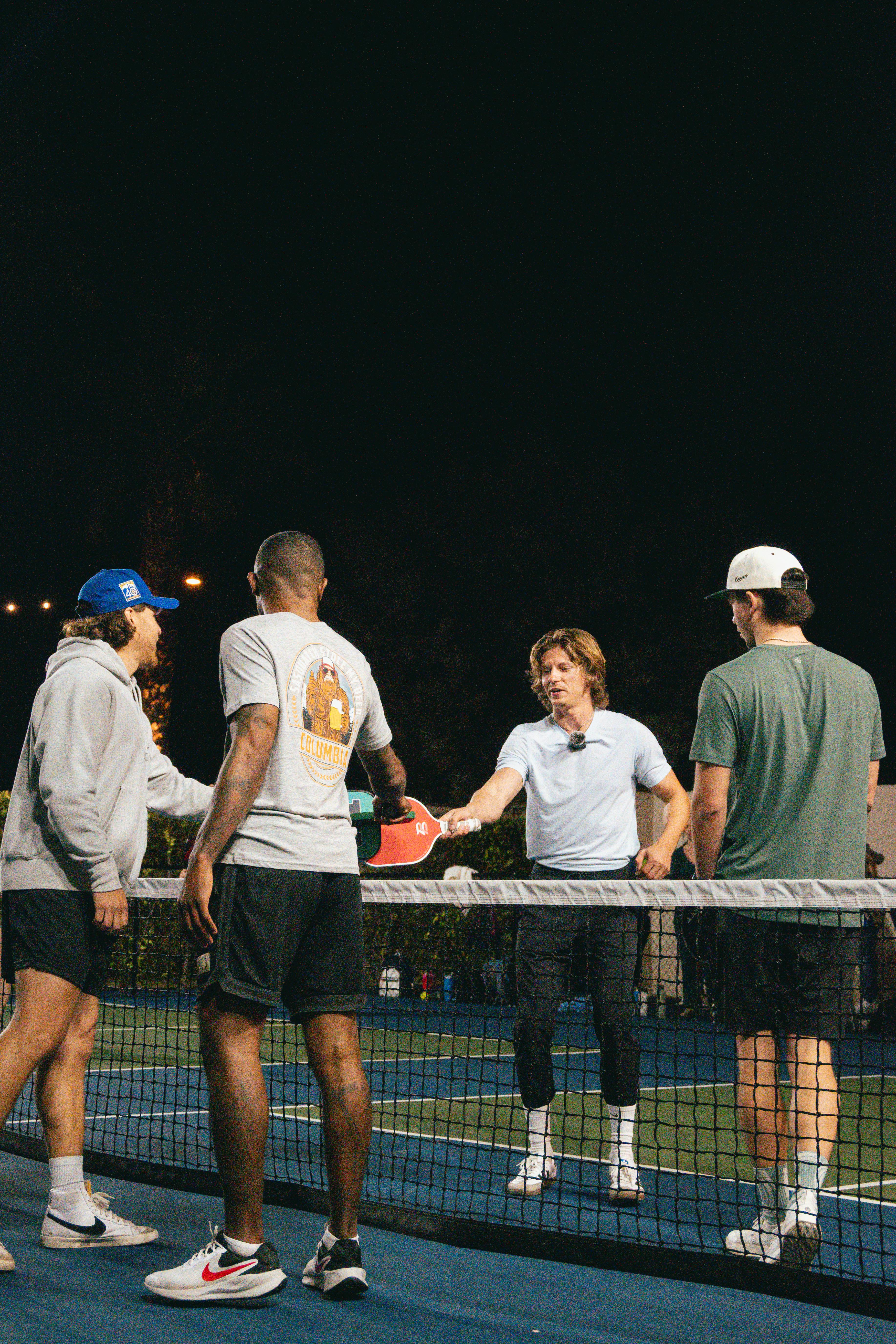 Pickleball players shaking hands after a match